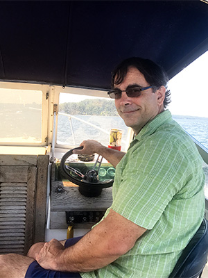 John Farrell operating a boat