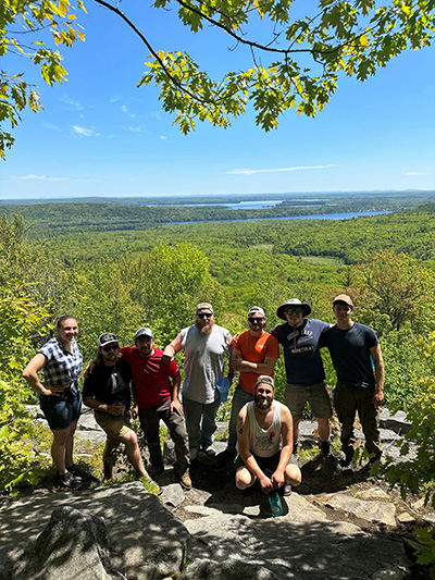 Group of alumni on a hike to Round Top in Belgrade lakes