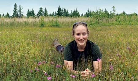 Greta Bader in orchid field