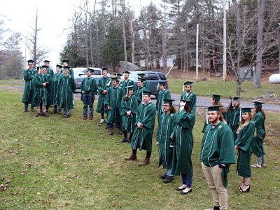 Ranger school students standing outdoors for graduation