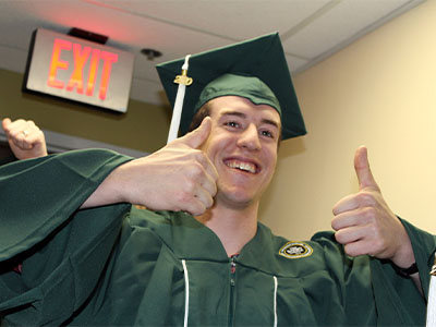 Ranger School grad with double thumbs up