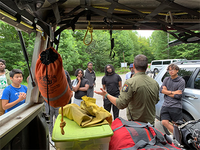 Timbuctoo participants meet NYC DEC Forest Ranger Scott Sabo, learning about the roles and responsibilities of being a forest ranger