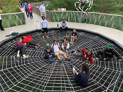 Participants exploring the spider's web along with the Wild Center's Wild Walk, Tupper lake, NY