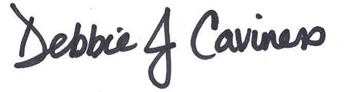 Signature of Alumni Director Debbie Caviness