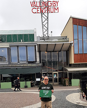 Ed Czyscon holding ESF flag in Vallingby, Sweden