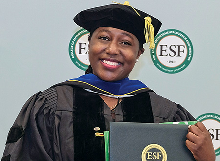 Charity Nyelele in graduation regalia