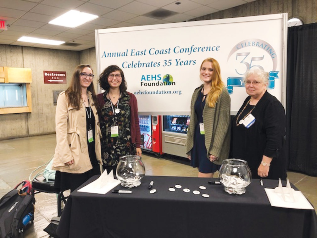 From left, Students Katherine Miller ’20, Olivia Malvasi ’20 and Carissa Caruso-DiPaola ’20 presenting posters at the 2019 Association of Environmental Health Sciences annual meeting, University of Massachusetts, mentored by Dr. Lee Newman, environmental health B.S. program curriculum coordinator.
