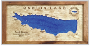 A map of Oneida Lake made of wood in a rectangular frame with Scott Shupe's name engraved on it as Conservationist of the year 2021