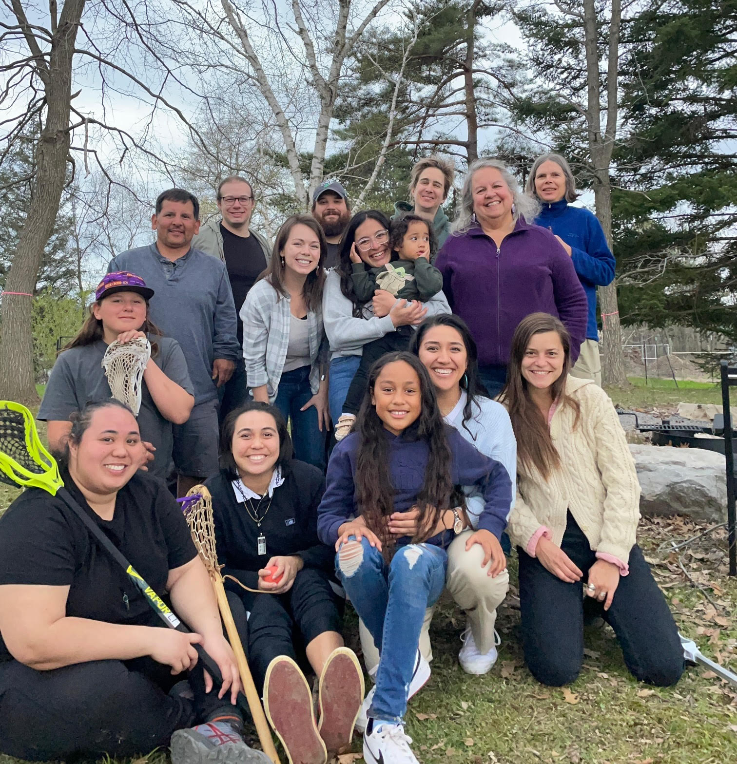 Group image of sloan indigenous graduate fellows and faculty and staff at a picnic