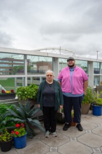 Dr. Lee Newman and Dan Collins on the Syracuse VA hospital Rooftop Garden.
