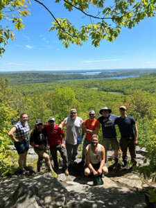 A group of ESF alumni who hiked to Round Top in Belgrade Lakes, Maine. Spring DeFranco '22, Tyler Urbanski '19, Jon Laselle '21, Noah Fyan ‘19, Nick Sims '20, Will Klein '22, Ben Balet '21, James Hart ‘21