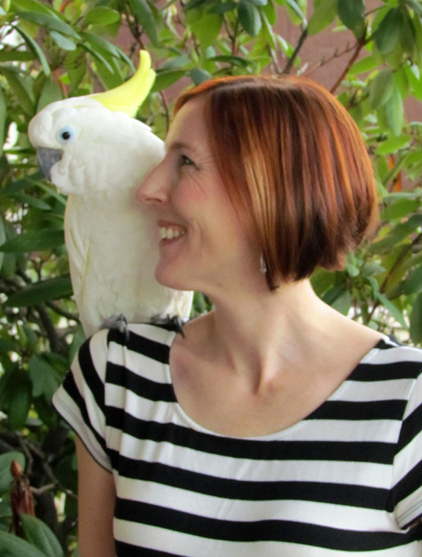 Christine Dahlin with a white parrot